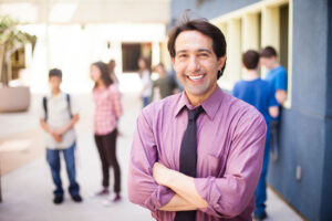 School principal posing outside classes