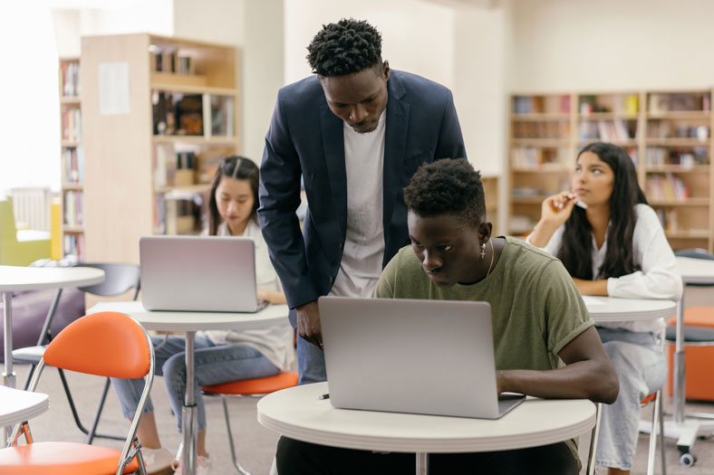 helping students on computers